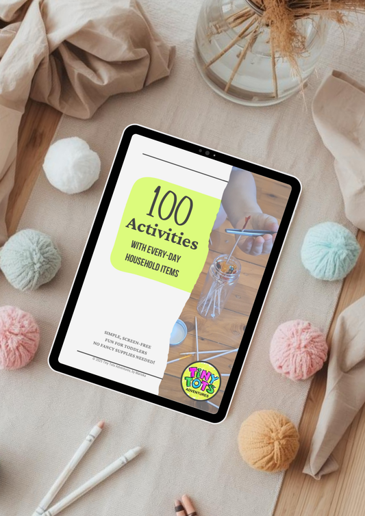 Tablet displaying a book titled '100 Activities with Every-Day Household Items' on a table