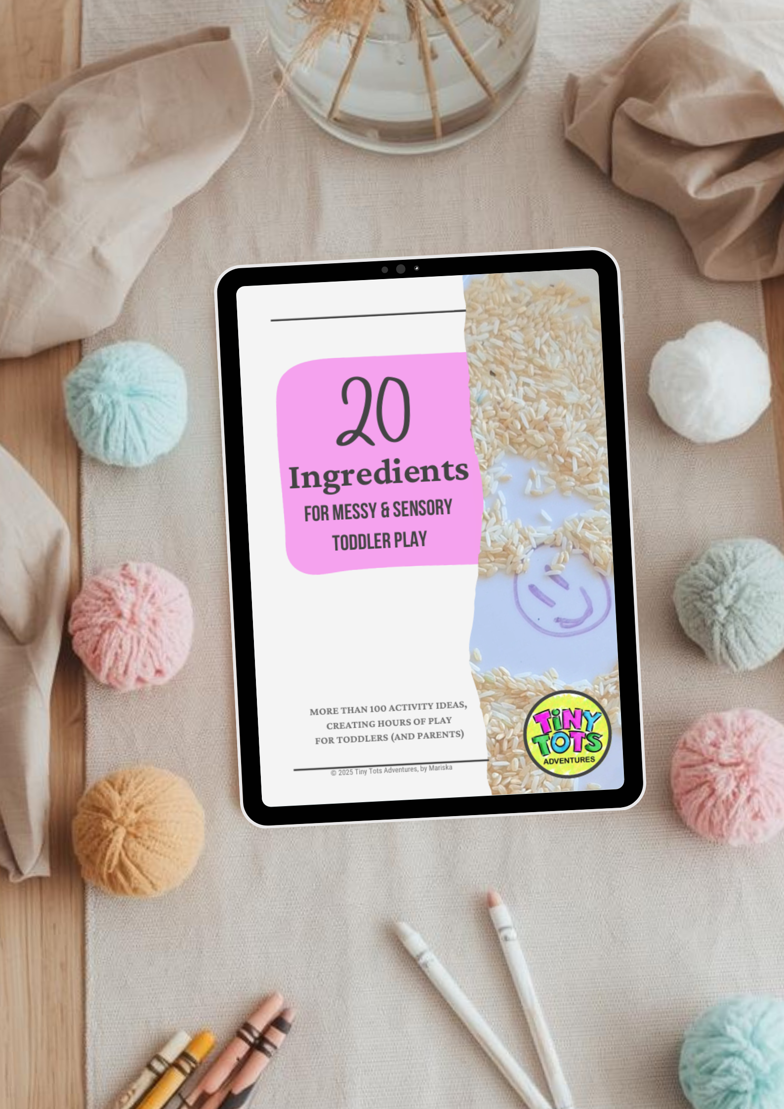 Tablet displaying a document titled '20 Ingredients for Messy & Sensory Toddler Play' on a table